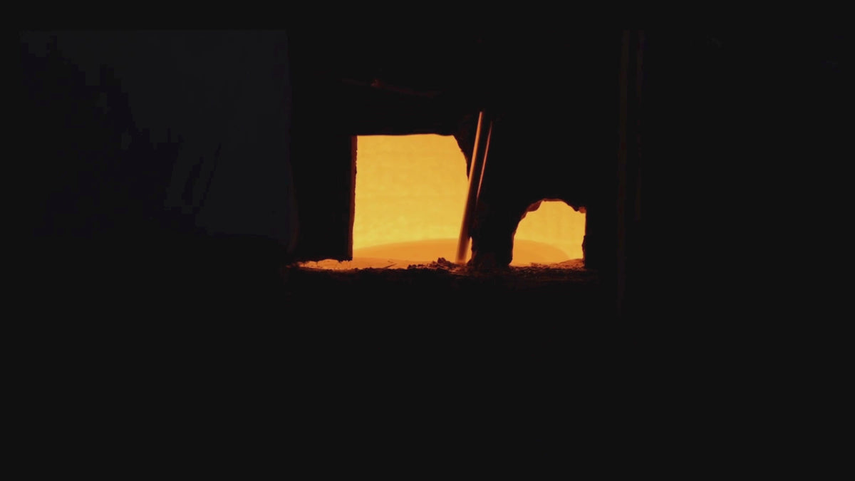 Manufacturing glass through a furnace